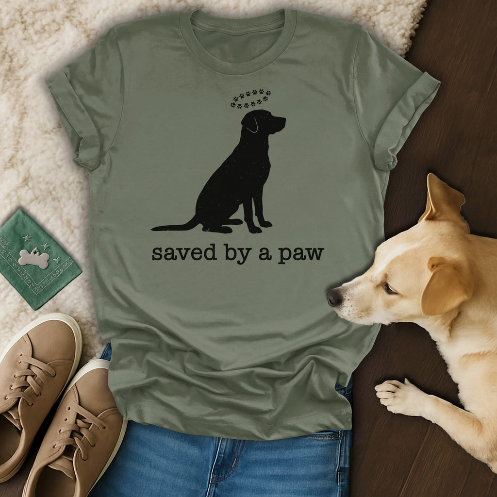 Dog silhouette wearing paw print halo, text reads "saved by a paw".