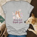 Heather gray v-neck t-shirt featuring a Cavalier King Charles Spaniel surrounded by pink flowers and text reading grows best beside you.
