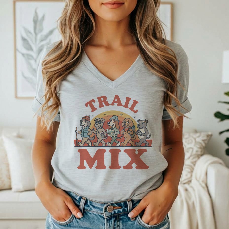 "Trail Mix" graphic on a grey t-shirt featuring cartoon dogs hiking.