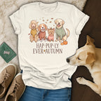 Cream t-shirt with illustration of four dogs and pumpkins, text reads "HAP-PUP-LY EVER AUTUMN".