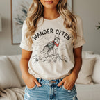 Cream t-shirt with "Wander Often" and a husky on a mountain.