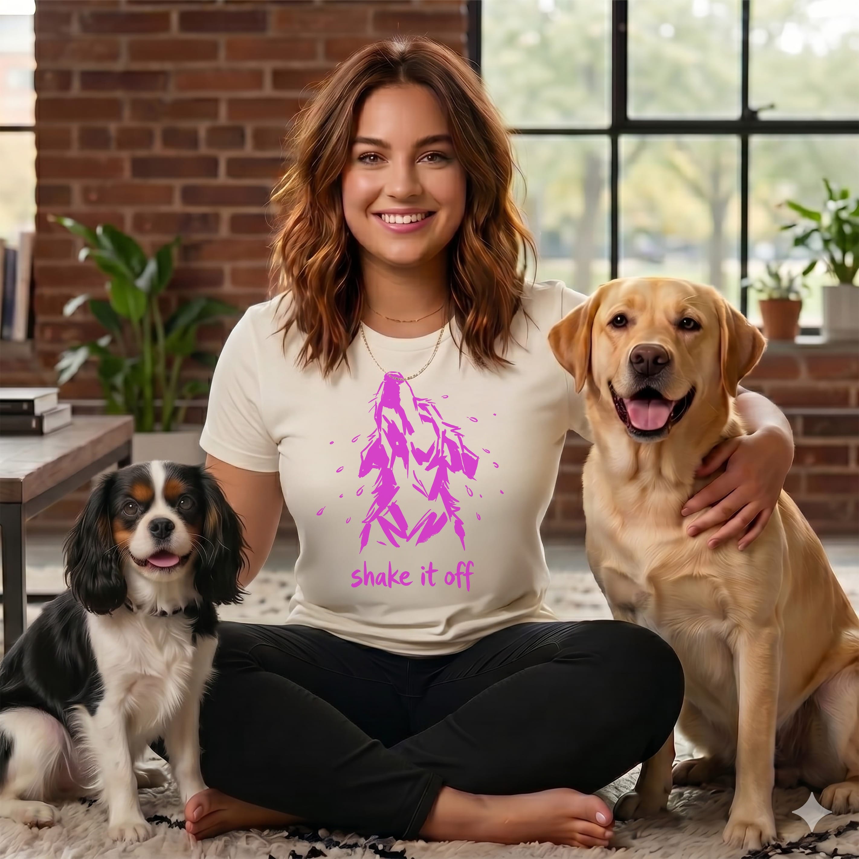 Woman with two dogs wearing t-shirt that says "shake it off".