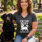 Woman with black Labrador on bench wearing shirt with "I'm Too Sexy For This Leash" text.