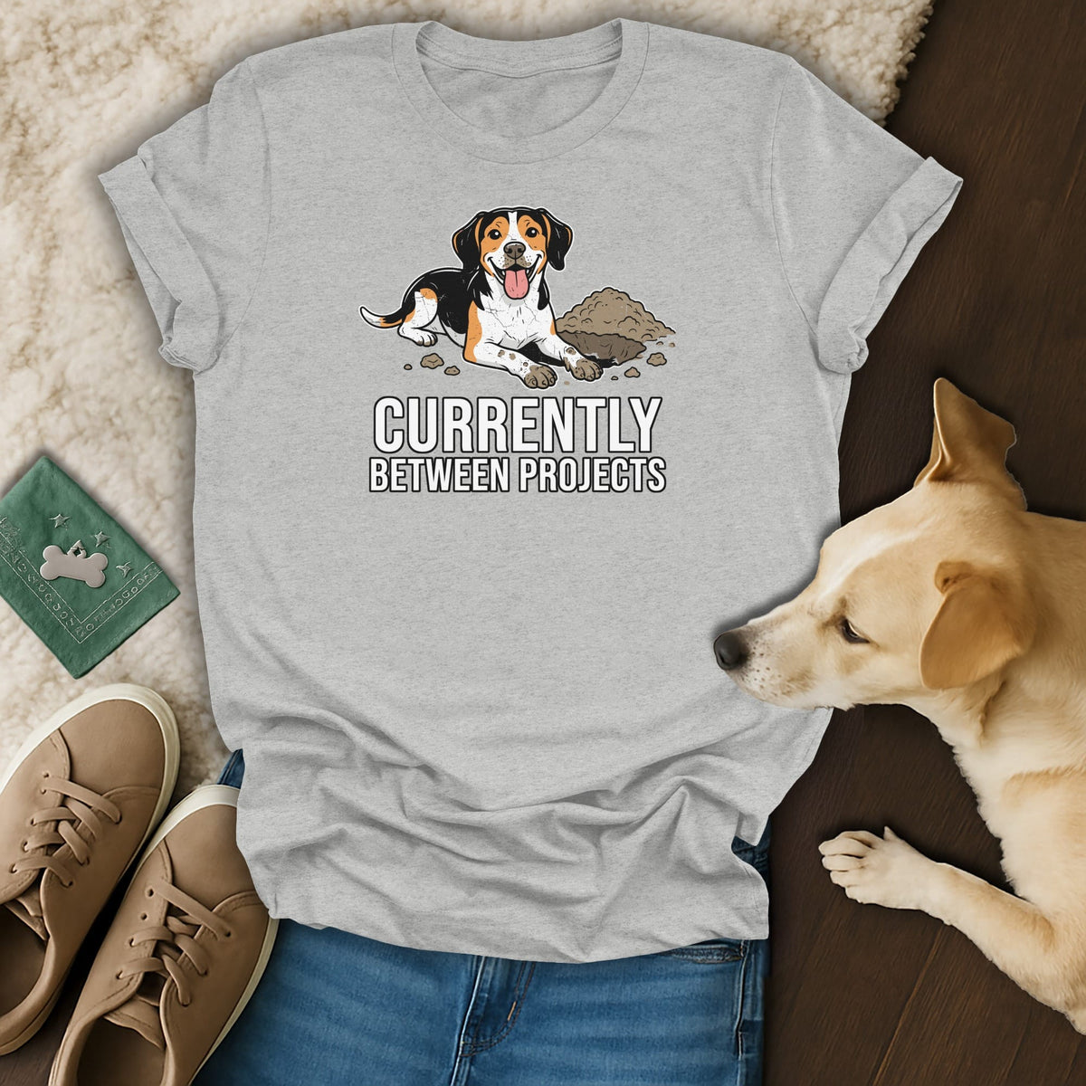 T-shirt with cartoon dog and text "Currently Between Projects".