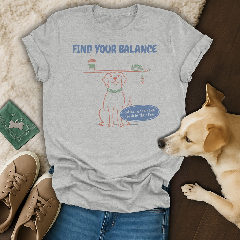Gray t-shirt with a dog balancing a coffee and leash. Text reads "FIND YOUR BALANCE."
