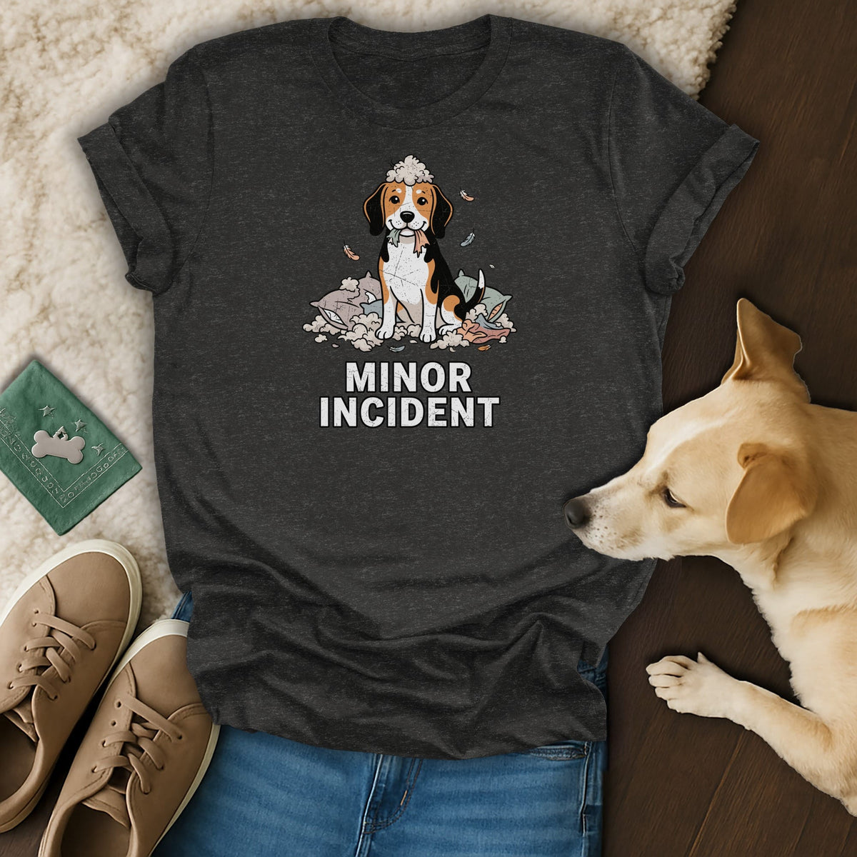 T-shirt with beagle sitting on scattered pillows with "MINOR INCIDENT" text.