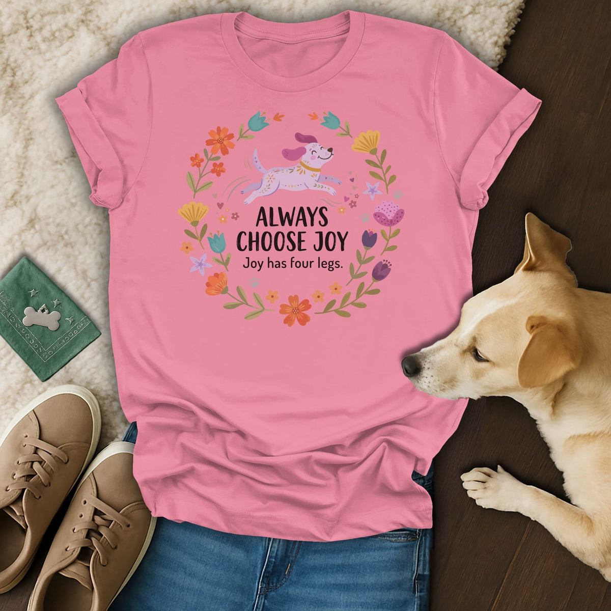 Pink t-shirt with a floral wreath design and text: "ALWAYS CHOOSE JOY Joy has four legs."
