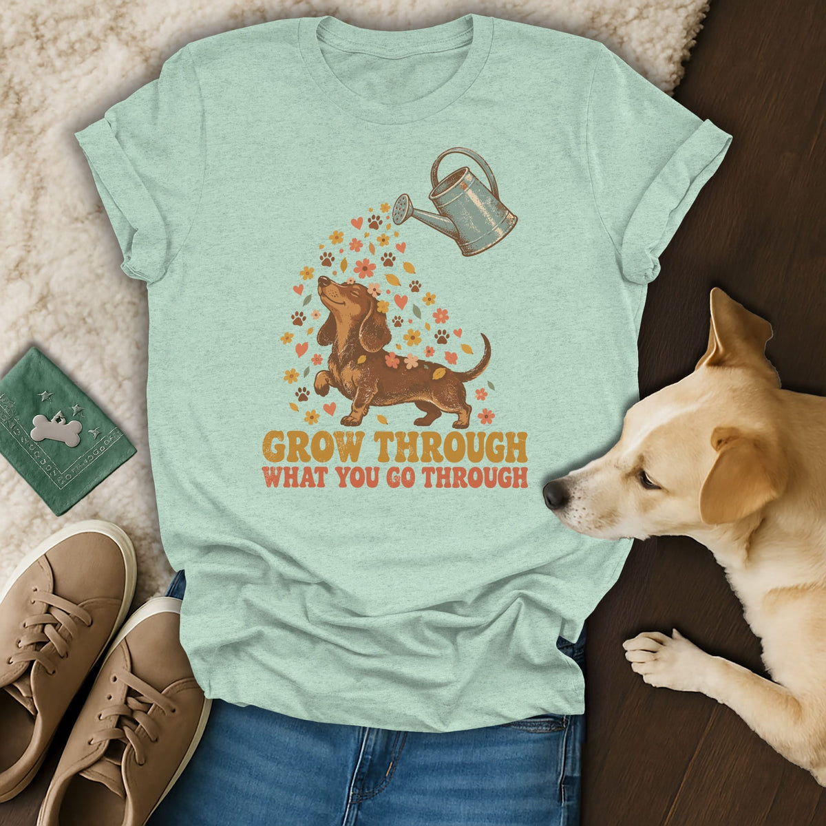 Light green t-shirt with a dachshund graphic and the text Grow Through What You Go Through.