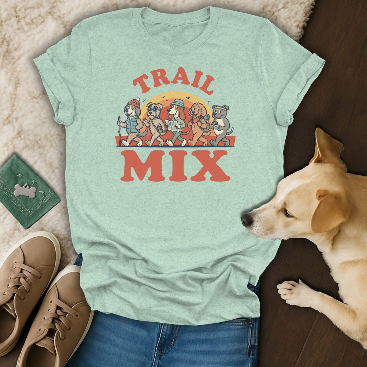 Light green t-shirt with "TRAIL MIX" text and dogs hiking at sunset graphic.
