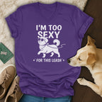 Purple t-shirt with white text and dog graphic: "I'm too sexy for this leash".