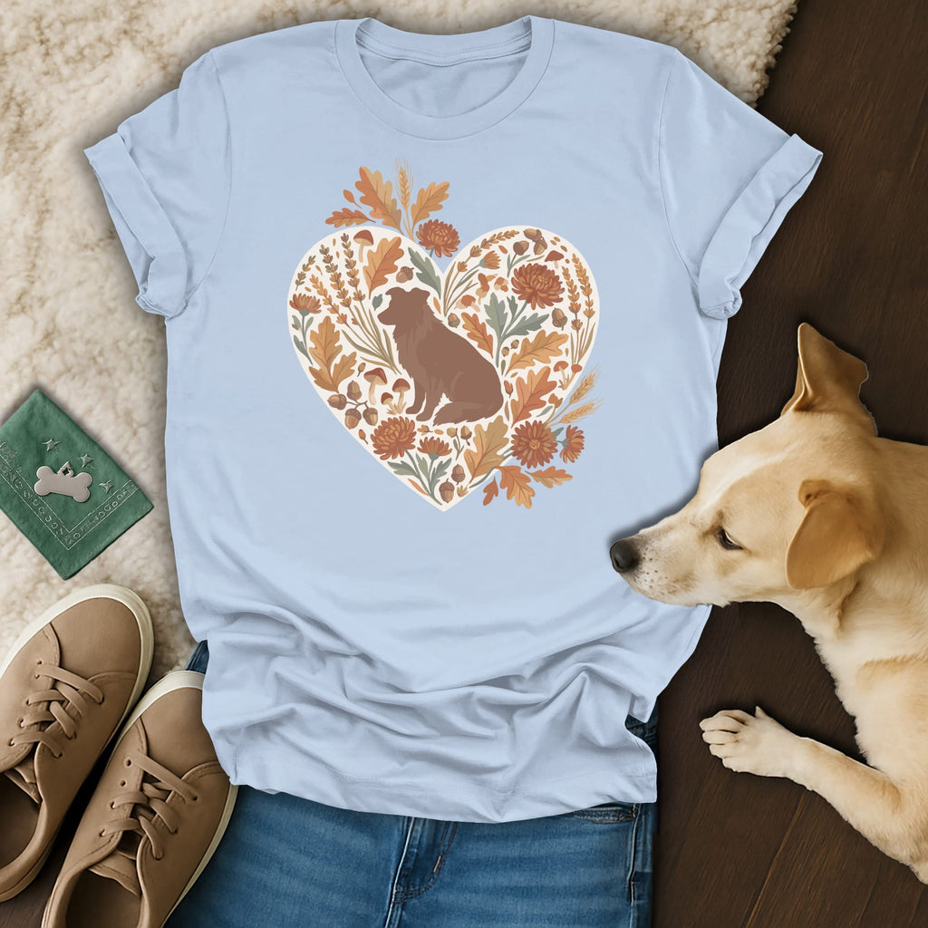 Light blue t-shirt with heart graphic of a seated dog and fall foliage.