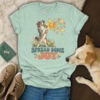 Mint green t-shirt with a vintage graphic of an Australian Shepherd holding a daffodil, with the text SPREAD SOME JOY.