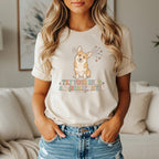 Corgi graphic on beige t-shirt reads "Tilt Your Head And Really Listen".