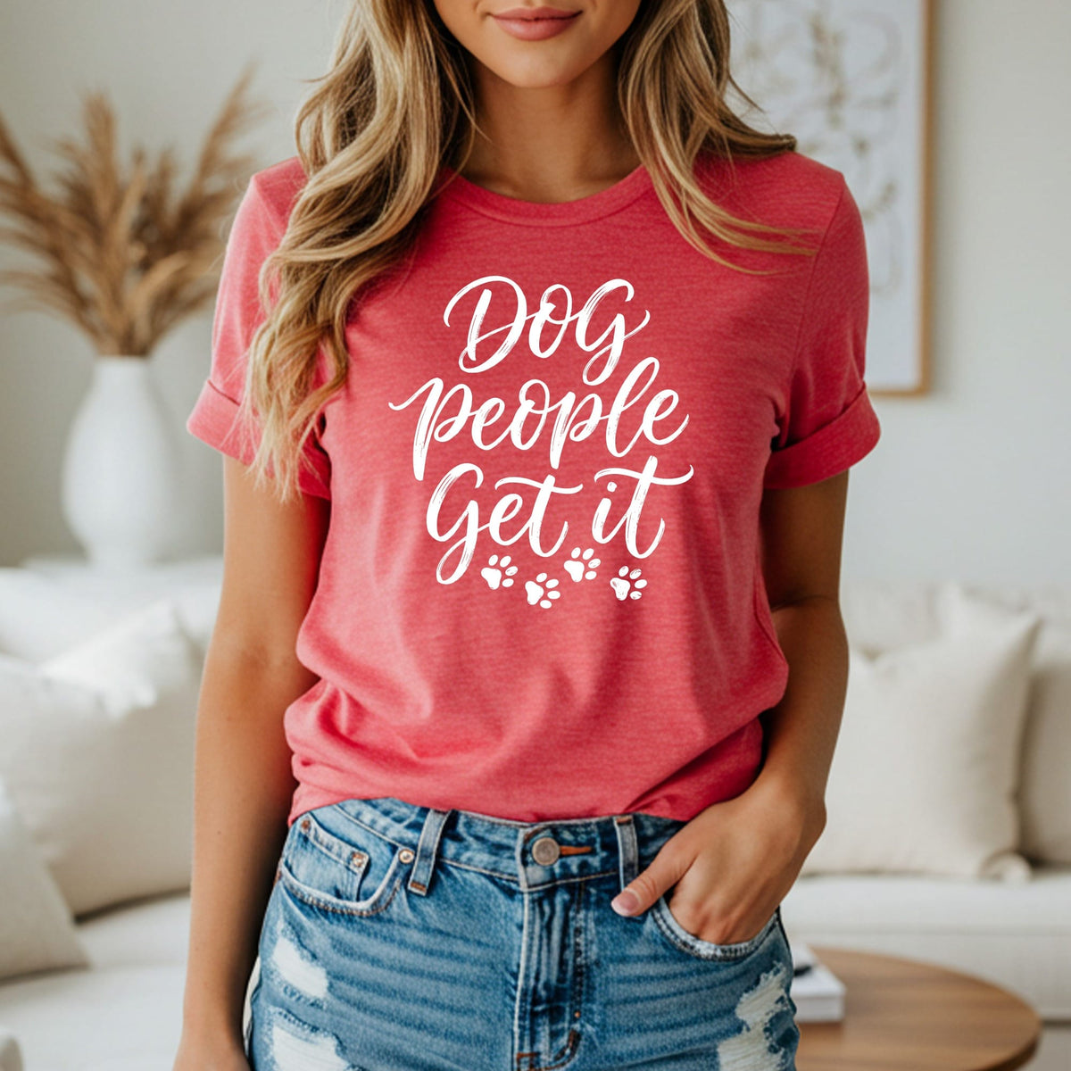 Coral t-shirt with white script text "Dog people get it" and paw prints.