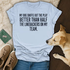 Light blue t-shirt with text about a dog's football knowledge.