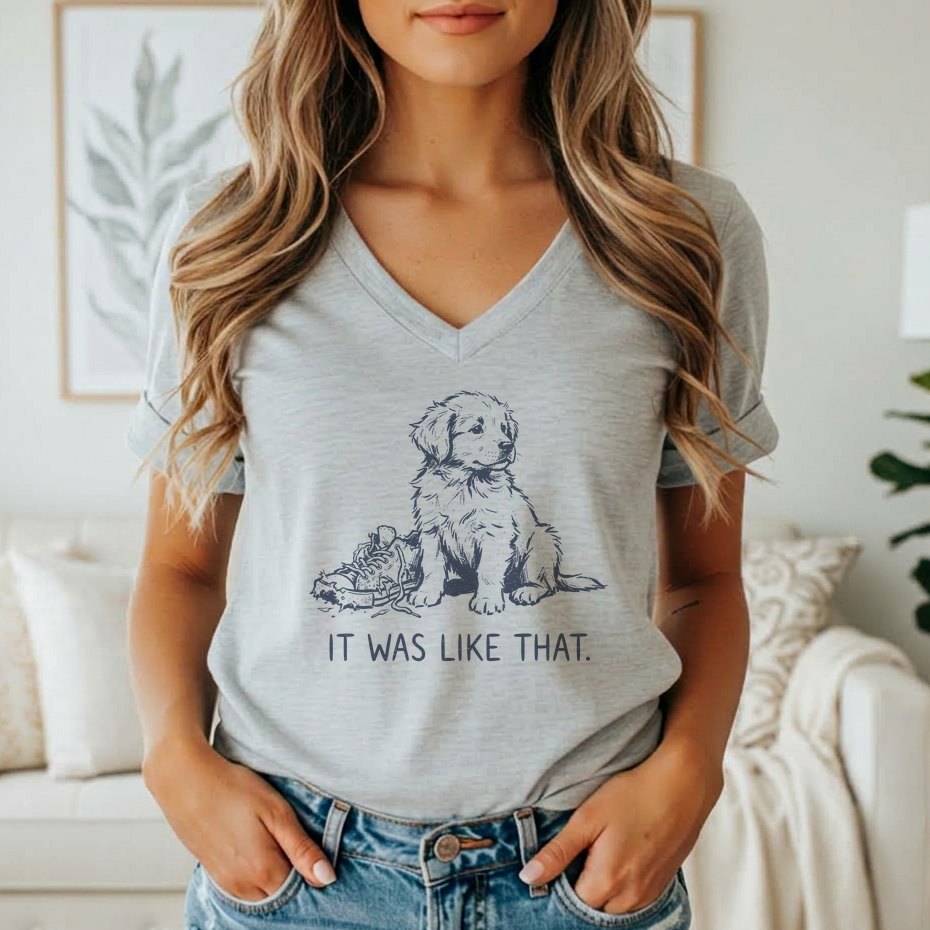 Grey t-shirt with a graphic of a puppy next to a chewed shoe and text "IT WAS LIKE THAT."