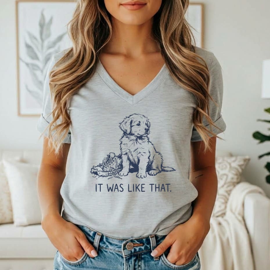 Grey t-shirt with a graphic of a puppy next to a chewed shoe and text "IT WAS LIKE THAT."