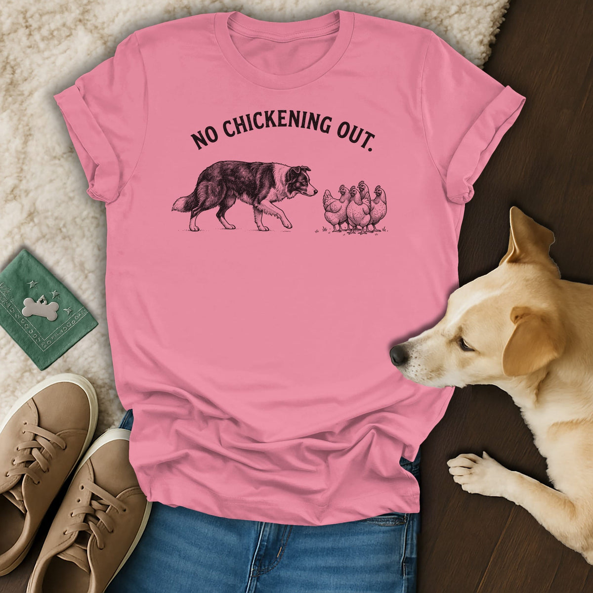 Pink t-shirt with a dog and chickens graphic and text "NO CHICKENING OUT."