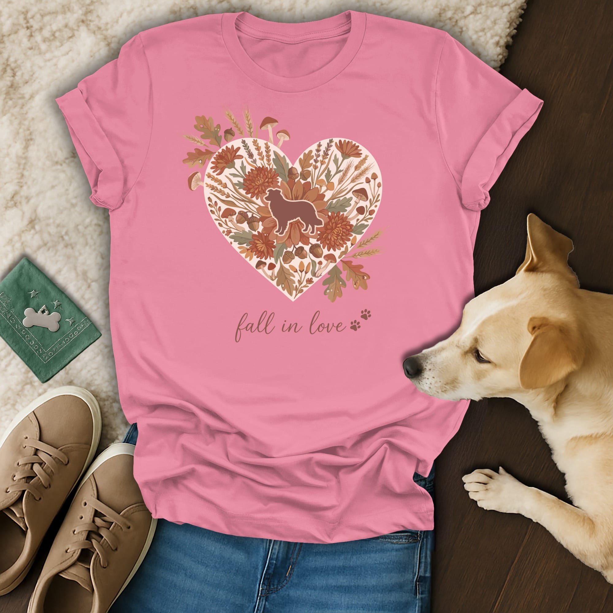 Pink t-shirt with heart floral design featuring a dog silhouette and "fall in love" text.