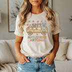 T-shirt graphic: four dogs in a hay cart with text "HAY THERE AUTUMN"