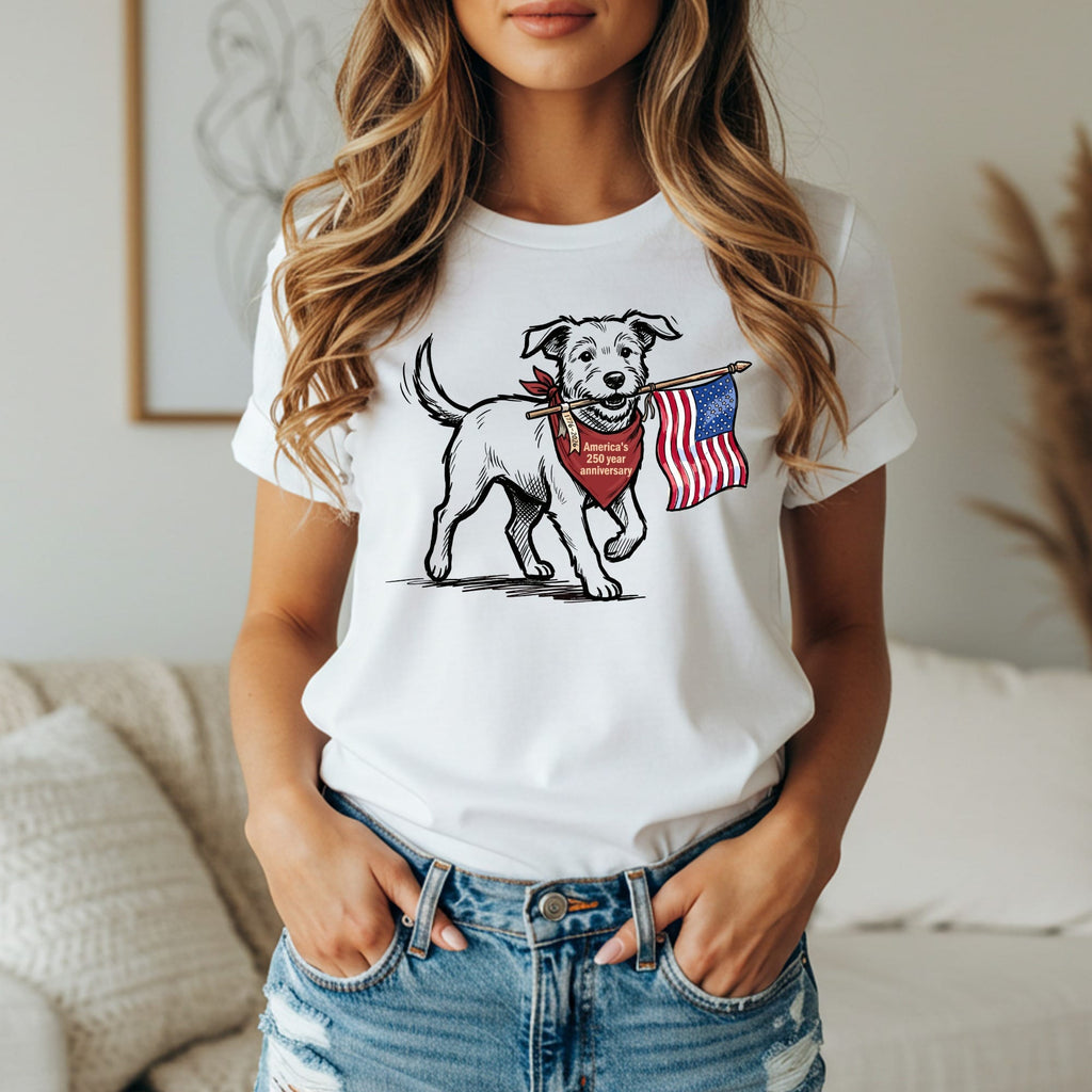 Dog wearing bandana holding American flag in mouth.