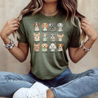 Green t-shirt with illustrations of 12 dog breeds and their puns.