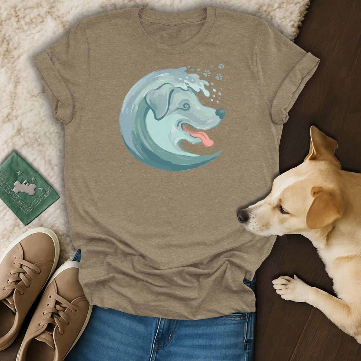 T-shirt with a watercolor dog design integrated into a wave, with paw prints.