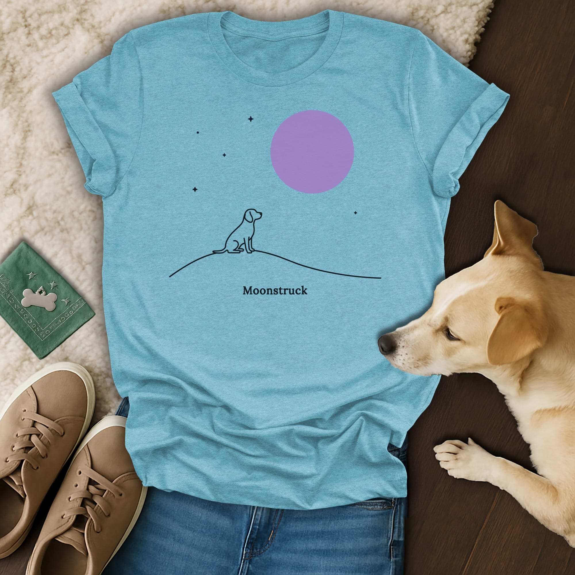 T-shirt with line drawing of dog sitting under a purple moon.