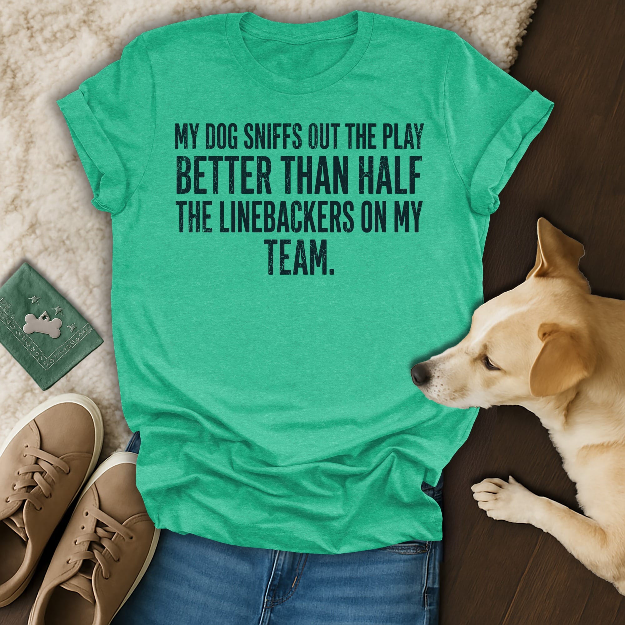 Green t-shirt with text about a dog's football play-sniffing ability.