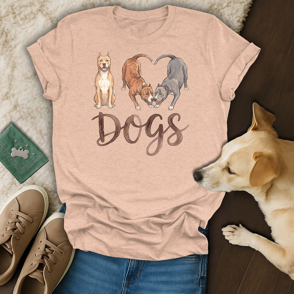 Peach t-shirt with "Dogs" text and three pit bulls, two forming a heart.