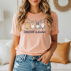 T-shirt with "SMASHIN' & dashin'" text and cartoon dogs playing pickleball.
