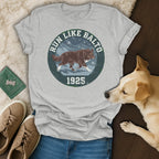 Grey t-shirt with "Run Like Balto 1925" text and wolf graphic.