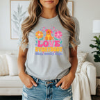 Gray t-shirt with a dog graphic saying "LOVE EVERYBODY Okay, mostly dogs."