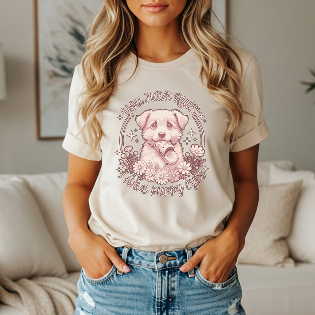 Lightweight tee with a puppy wearing a slipper, surrounded by flowers and text.