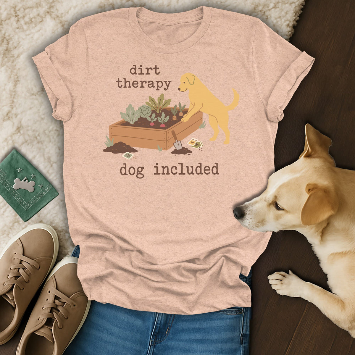 Peach t-shirt with "dirt therapy dog included" text and illustration of a dog gardening.