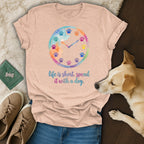 T-shirt with watercolor clock and dog paw prints, reads "Life is short. Spend it with a dog."