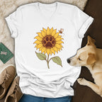 A white V-neck t-shirt featuring a sunflower graphic with a dog paw center and a small bee.