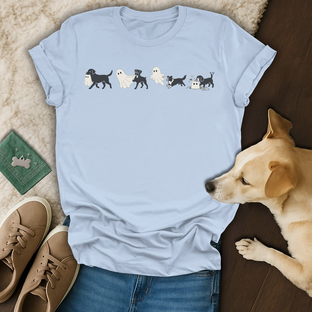 Light blue t-shirt with cartoon dogs in ghost costumes and a playful dog.