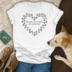 White t-shirt with heart of paw prints and text "bad days are no match for a good dog".