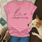 Pink t-shirt with "we the people and our dogs" text and feather/paw print design.