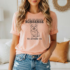 Peach t-shirt with drawing of corgi and text "I HAVE DOG-RELATED NONSENSE TO ATTEND TO".