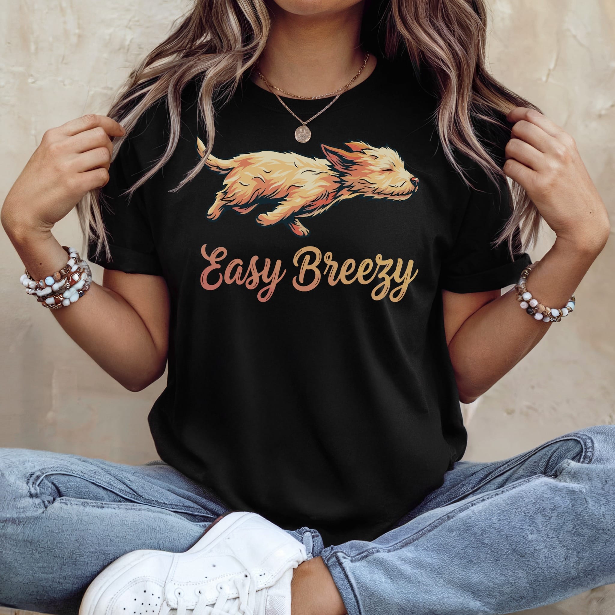 Black t-shirt with "Easy Breezy" and a stylized dog graphic.