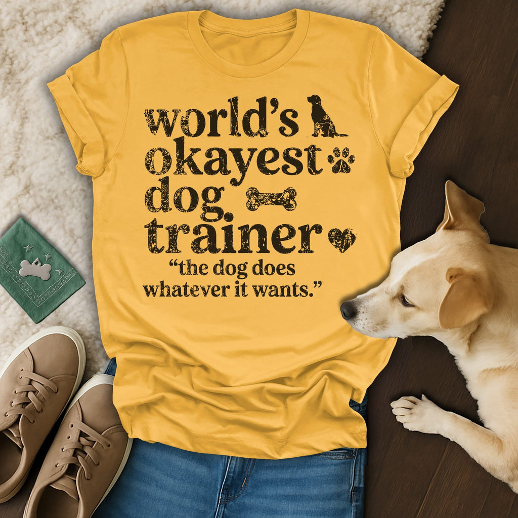 Yellow t-shirt with "world's okayest dog trainer" and dog graphic.
