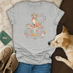 T-shirt with a colorful dog on a quilt and text that says "Quilty As Charged".