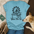 T-shirt with dog at vanity mirror applying makeup, text "Glam-Fur-Us".