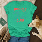 Green t-shirt with "Doodle Mom Club" text and doodle dog illustrations.