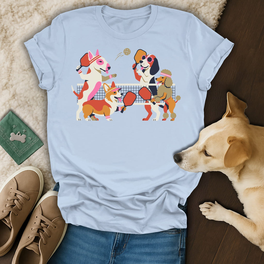 Light blue t-shirt with graphic of dogs playing pickleball.