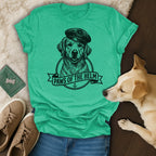 T-shirt with a black line drawing of a golden retriever wearing a beret and anchor emblem.
