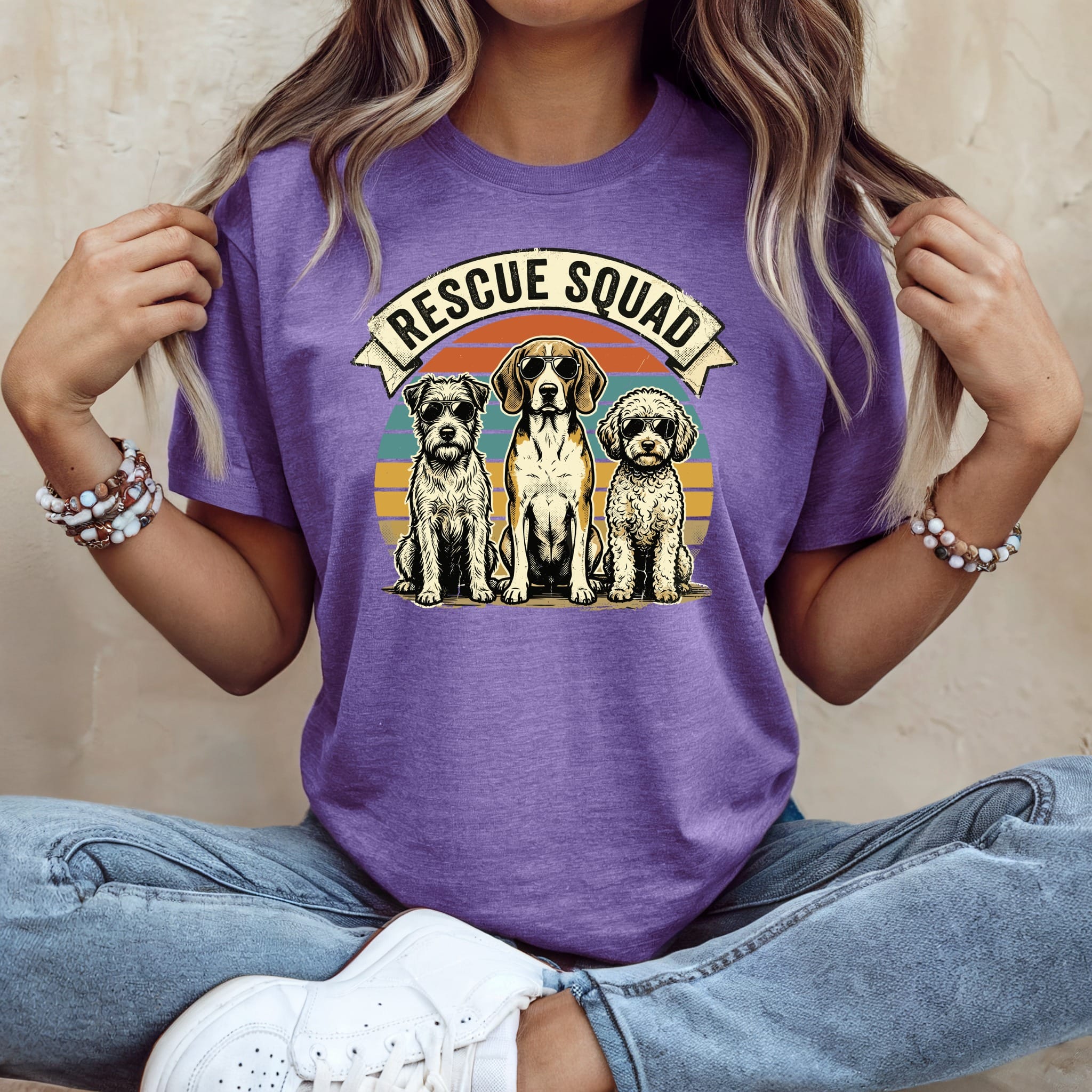 T-shirt with "Rescue Squad" text and three dogs sitting in front of a sunset.