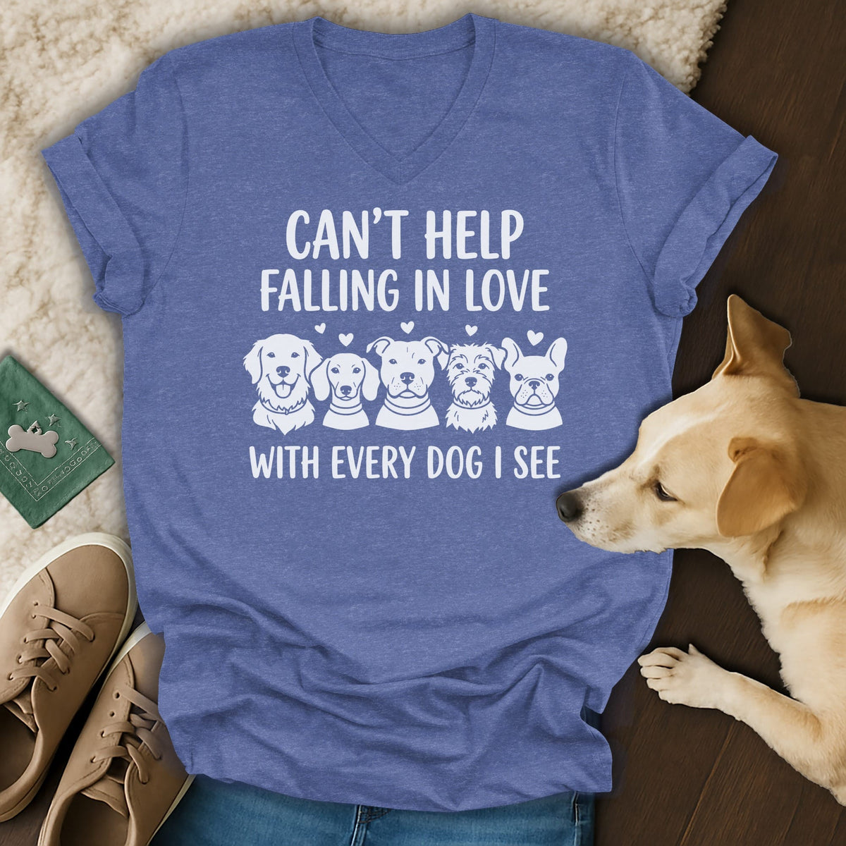 Blue v-neck t-shirt with white text and dog graphics, "Can't Help Falling In Love With Every Dog I See."